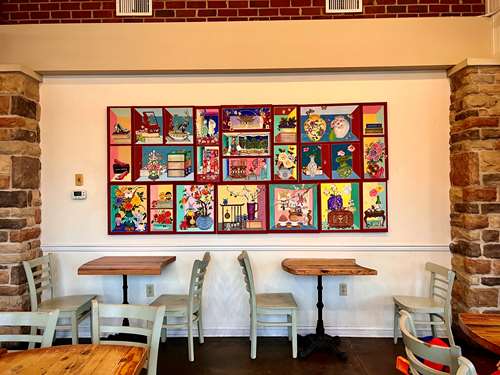 Chaekgado on the Wall of the Cafe with Tables and Chairs 