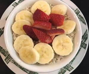 Our homemade and delicious Oatmeal, topped with fresh seasonal fruits